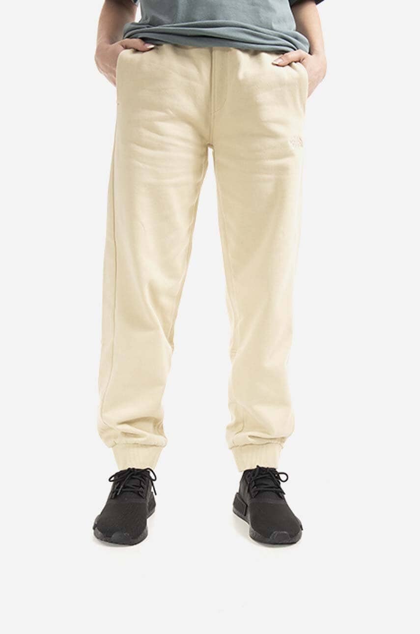 Βαμβακερό παντελόνι The North Face Oversized Jogger χρώμα: μπεζ